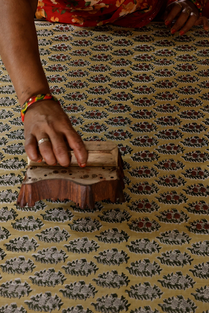 Jaipur artisan hand block printing botanical cotton fabric — traditional craft process behind Daughters of India